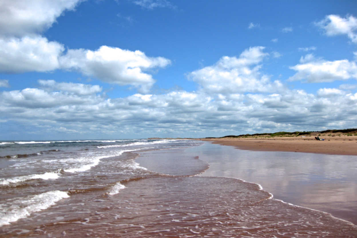 red-sand-and-waves-prince-edward-island-canada